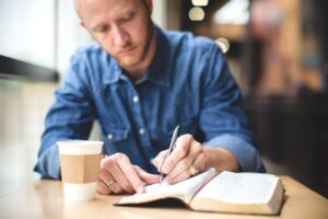 business man writing a nonfiction book
